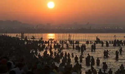 Devotees taking holy dip during sunrise
